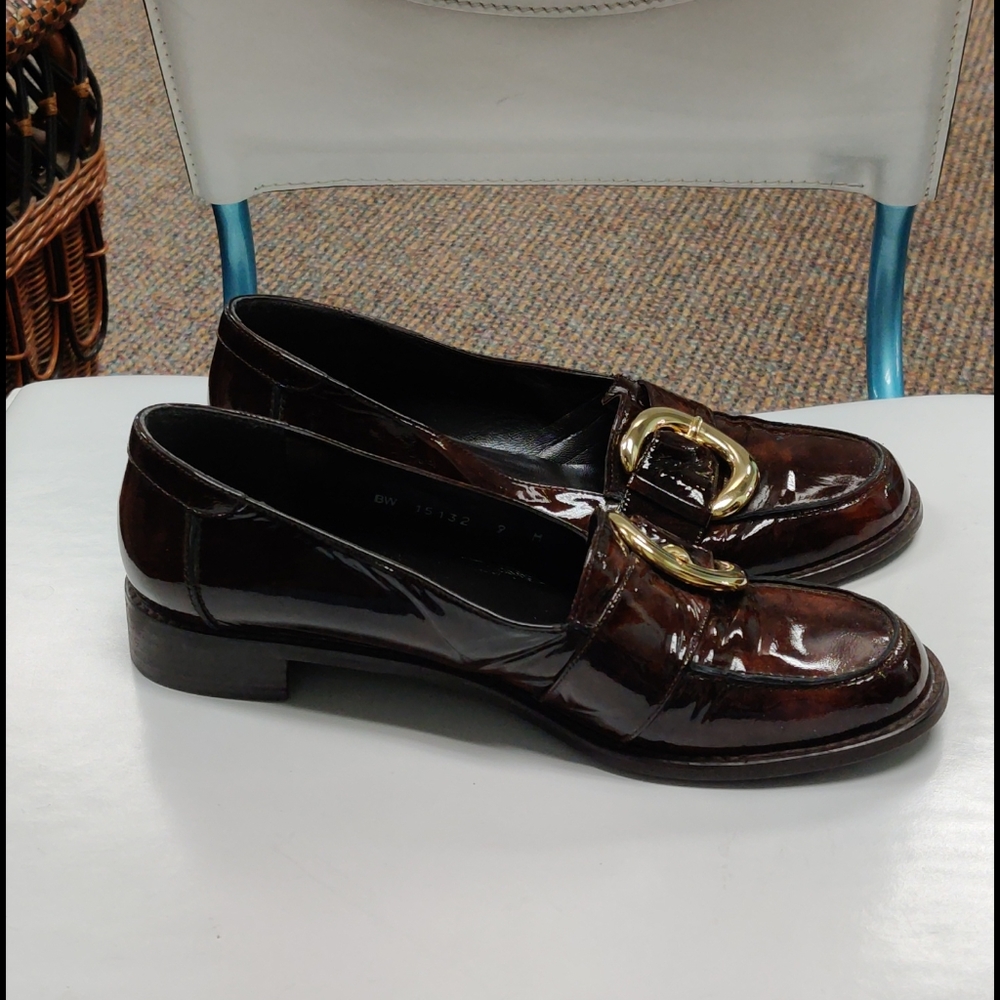 Brown Stuart Weitzman loafers with gold buckle